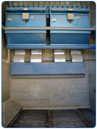 Receiving pit filter for dust generated from unloading organic material from a truck