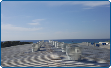 Ventilation of a production hall with 50 dual-purpose roof fans, model RFS750, ventilation and emergency smoke release