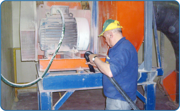 Cleaning production machines in a factory with a lot of airborne dust