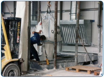 Exhaust hood with slots for suction from a bulk bag discharge pit