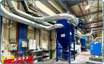 Large-radius dust extraction piping in a galvanized structure